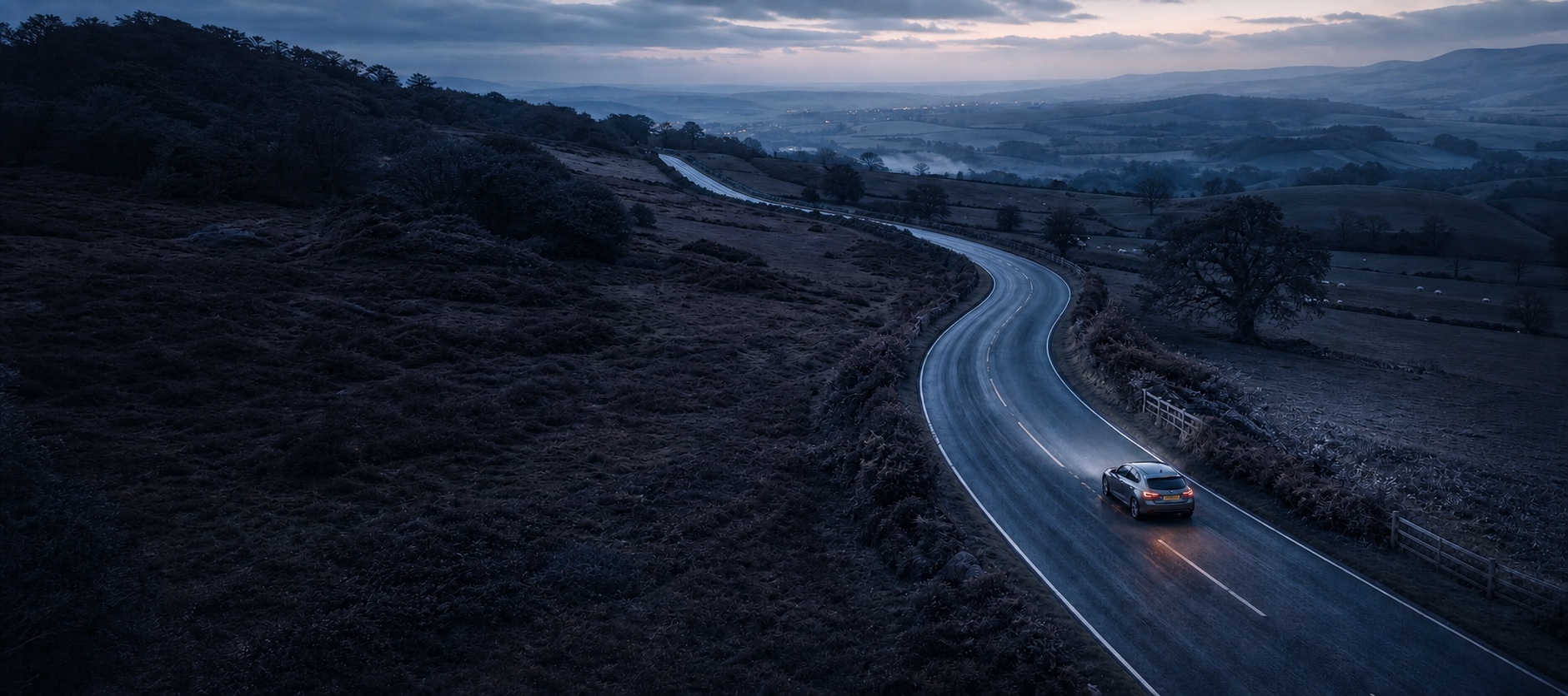 A quiet road winding through the British countryside